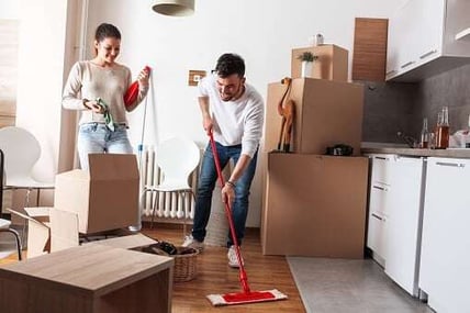 couple cleaning and moving out of house