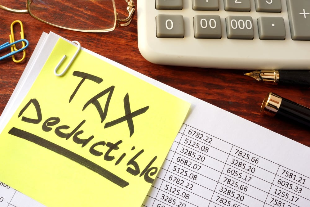 tax deductible written on sticky note