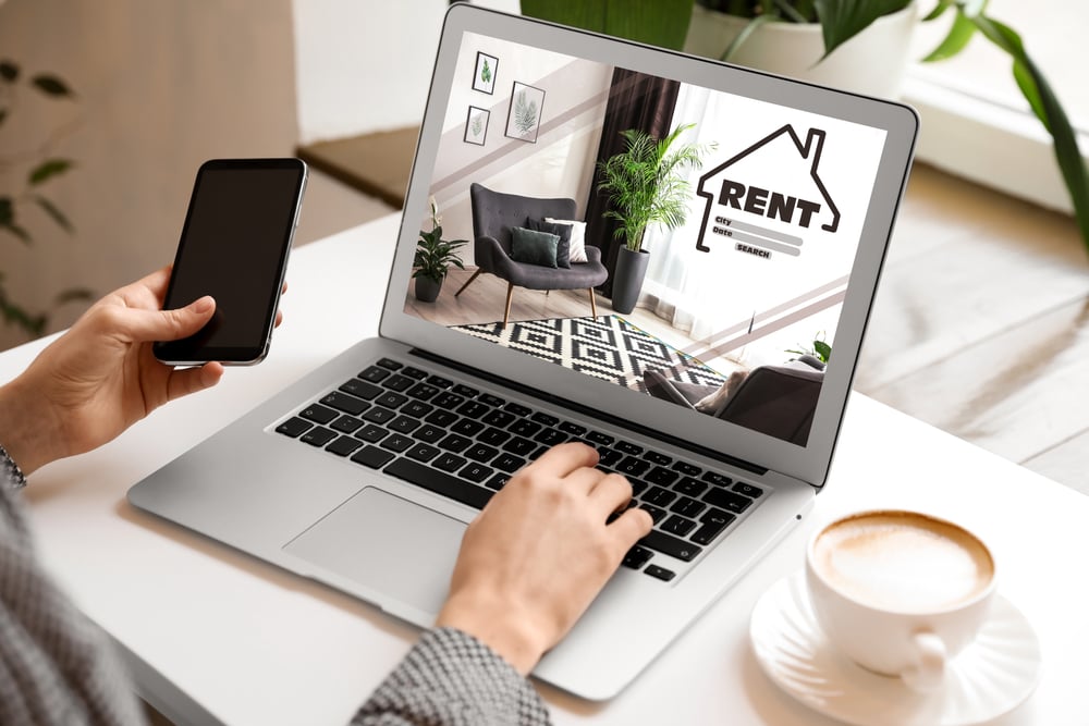 person looking at rental property photos online